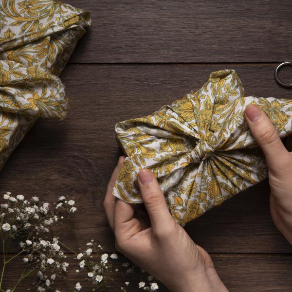 view-over-hand-holding-package-furoshiki-scaled
